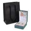 Extra-small black luxury paper gift bag with rope handles beside an open jewellery box.