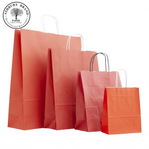 Red Colour Paper Carrier Bags. From left to right: Extra large, large, medium, small. With twist handles. Paper Bags Ireland