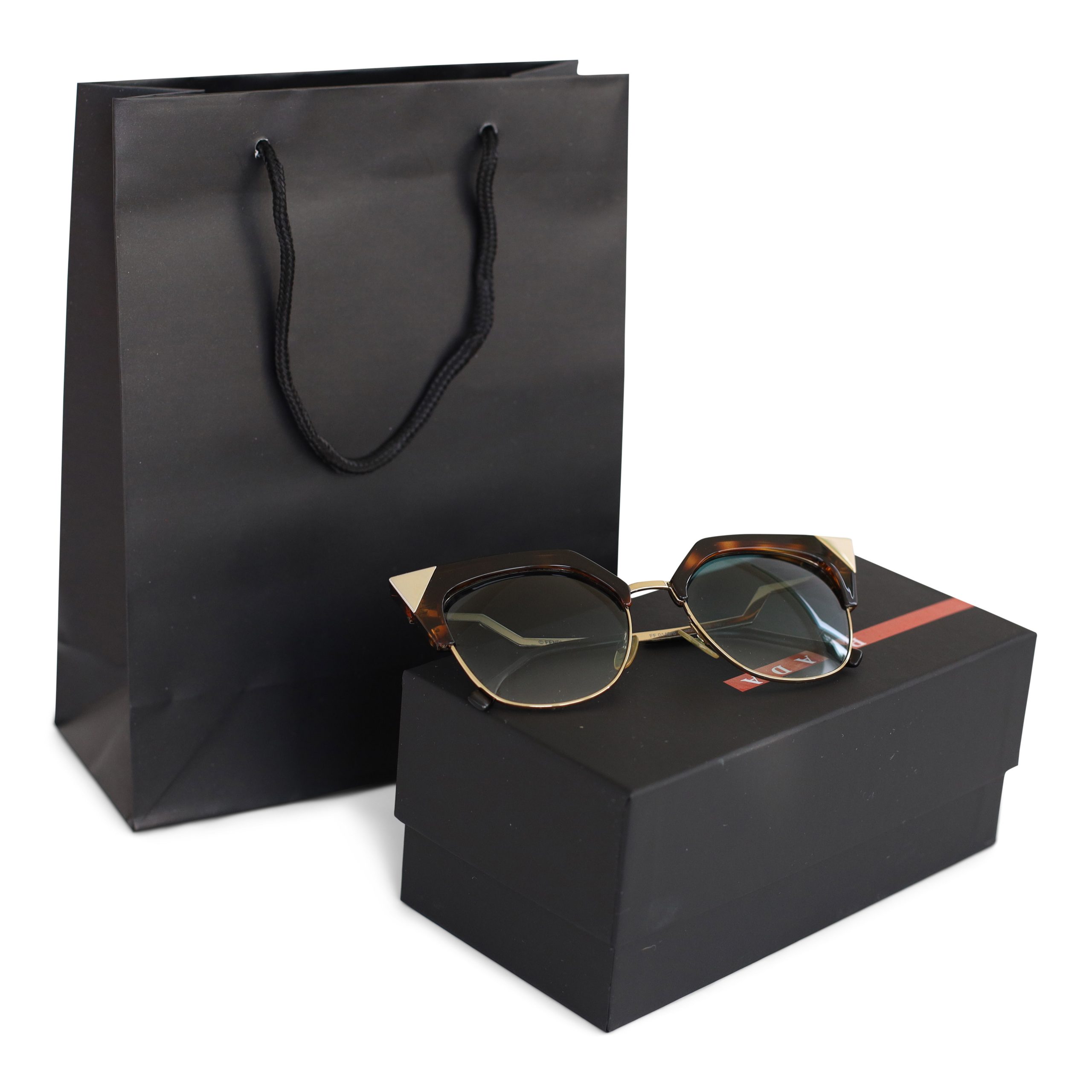 Small portrait black luxury paper gift bag with rope handles shown beside a boxed pair of sunglasses.