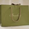 Luxury branded paper bag with rope handles and ribbon for jewellery retail