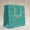 Luxury branded paper bag with patterned print and rope handles