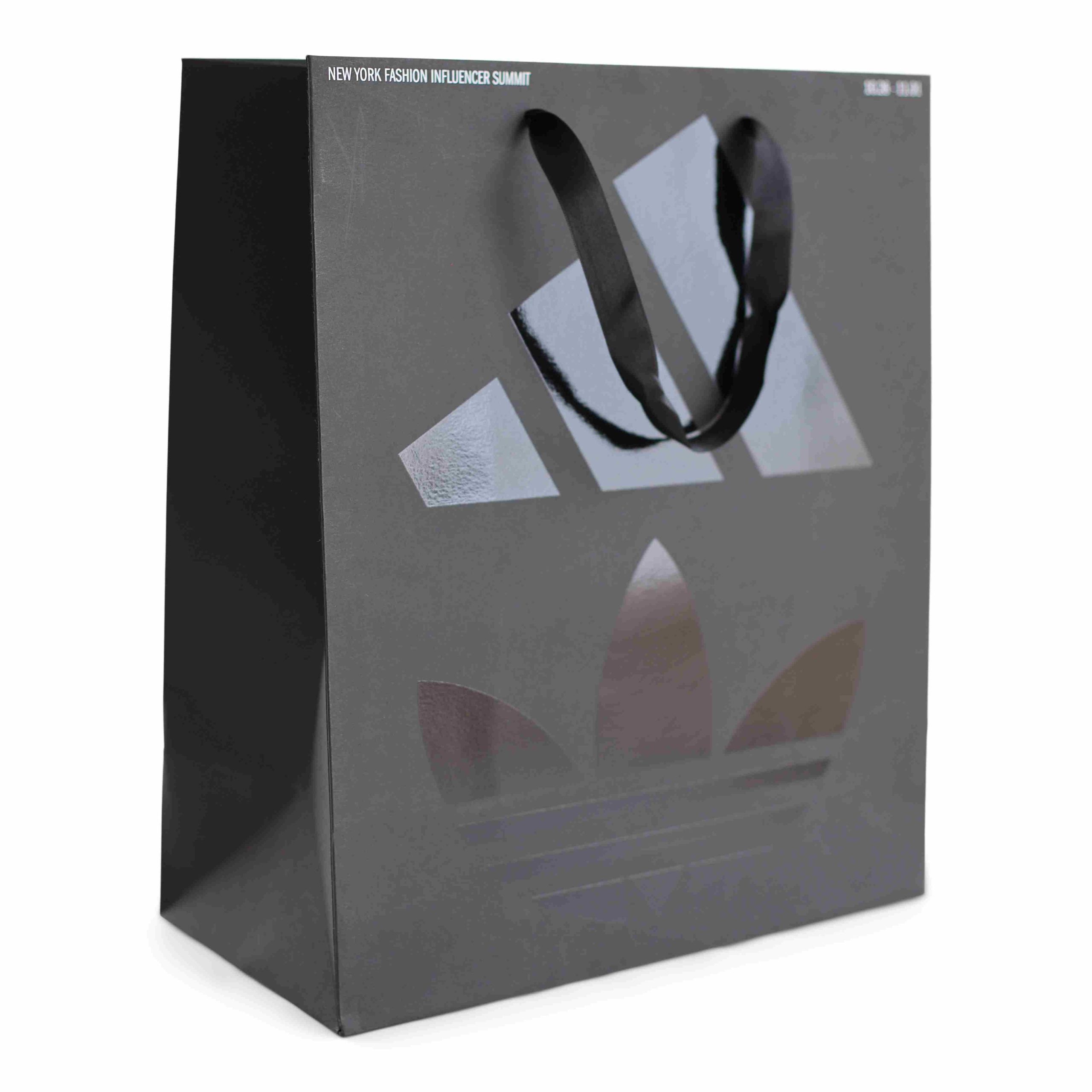 Luxury branded paper bag with ribbon handles for fashion and events