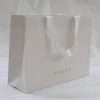 Luxury branded paper bag with rope handles for hotel and resort retail